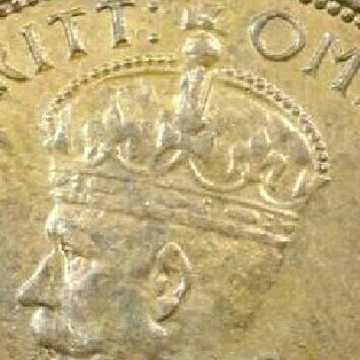 Missing band detail on the obverse of a 1934 half penny