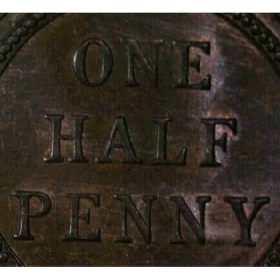 Die cleaning striations on the reverse of a 1935 half penny