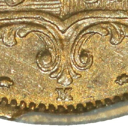 Melbourne Mint 'M' mintmark directly below the shield and between two rosettes.