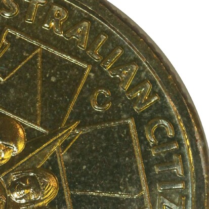 Canberra (C) mint-mark on 2009 (Citizenship) one dollar piece.