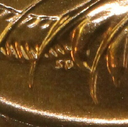 The initials of the designer Stuart Devlin (SD) on a 1987 One Cent.