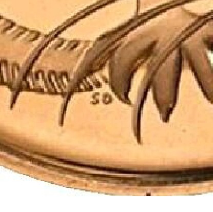 The initials of the designer, Stuart Devlin (SD), on a 2006 Silver Proof One Cent.