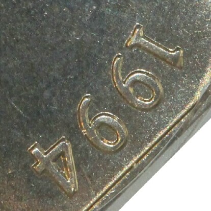 Wide-date variety of the 1994 Fifty Cent (Year of the Family) piece.