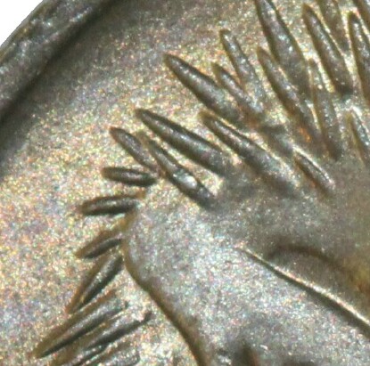 A long spine indicates that the 1966 five cent was minted in London.