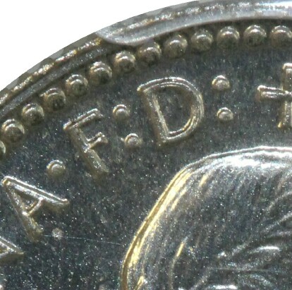 Defender of the Faith 'F.D' inscription on a 1955 Proof Sixpence.