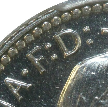 Defender of the Faith 'F:D' inscription on the obverse of a 1962 Proof Sixpence.