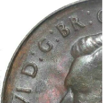An uneven strike causing a weak rim on the obverse of a 1948 Perth mint half penny