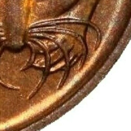 No blunted whiskers indicate the coin was minted in Canberra.